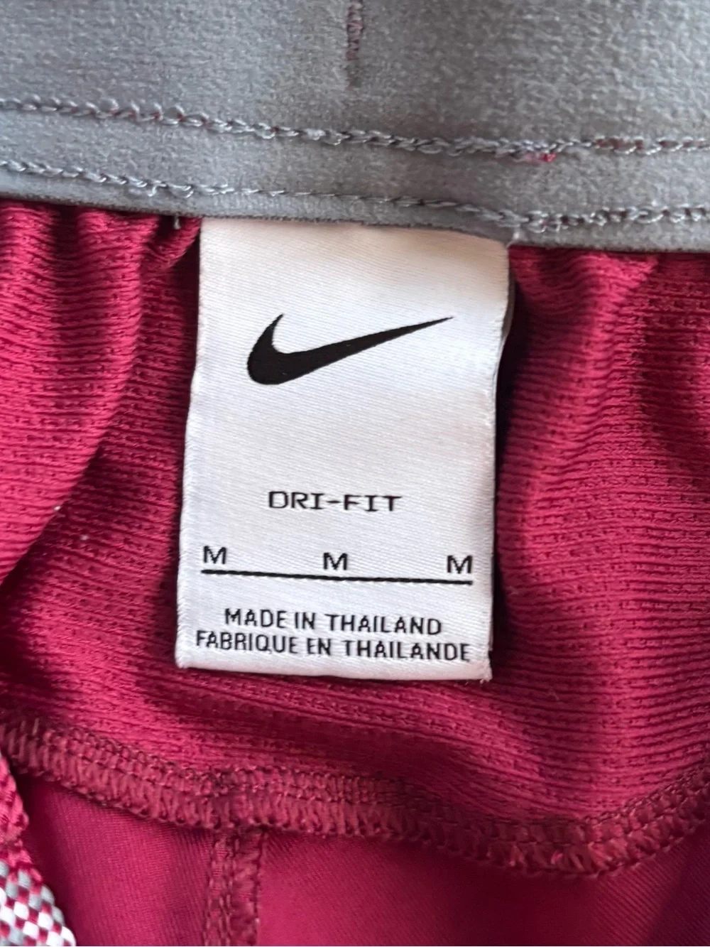 Nike Women’s Maroon Athletic Shorts with White Side Stripe